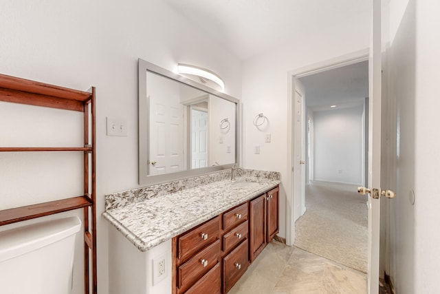 bathroom with toilet and vanity