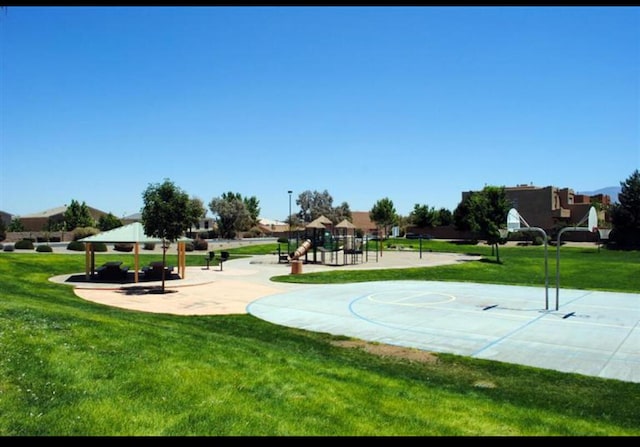 view of basketball court with a lawn, playground community, and a gazebo