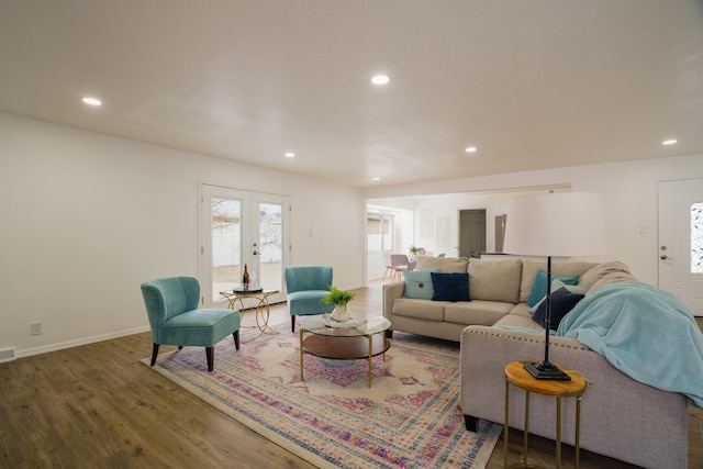 living room featuring baseboards, french doors, dark wood-style flooring, and recessed lighting