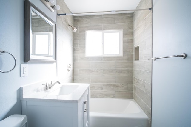 full bathroom featuring  shower combination, vanity, and toilet