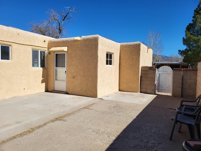 exterior space with a gate and fence