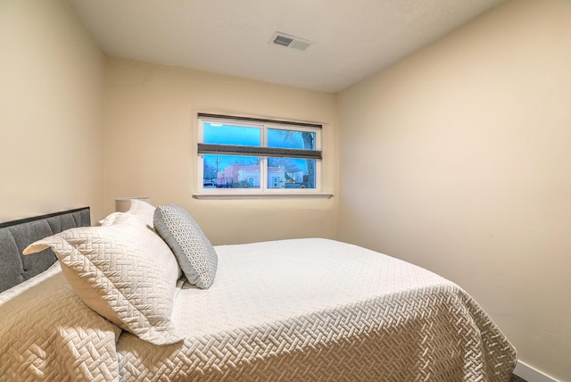 bedroom featuring visible vents