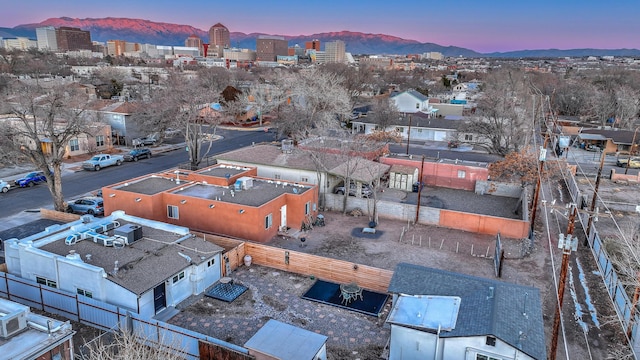 birds eye view of property featuring a mountain view and a city view