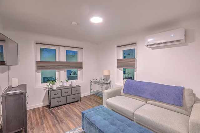 living room featuring dark wood-style floors, a wall mounted air conditioner, and baseboards