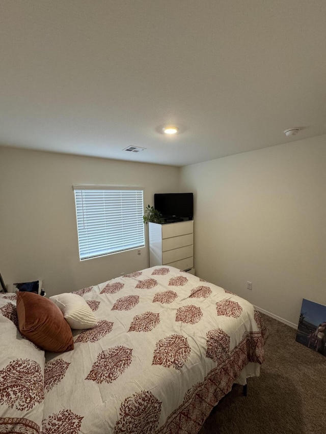 bedroom featuring carpet floors and visible vents