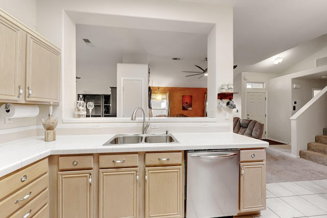 kitchen with dishwasher, ceiling fan, open floor plan, a peninsula, and a sink