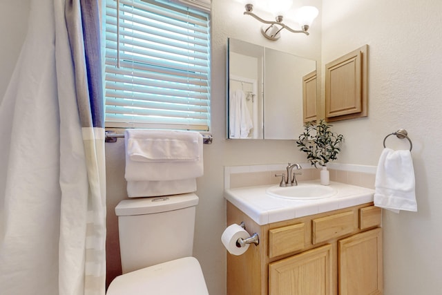 full bath with vanity and toilet