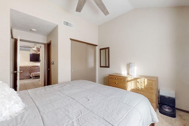 bedroom with ceiling fan, carpet flooring, visible vents, vaulted ceiling, and a closet