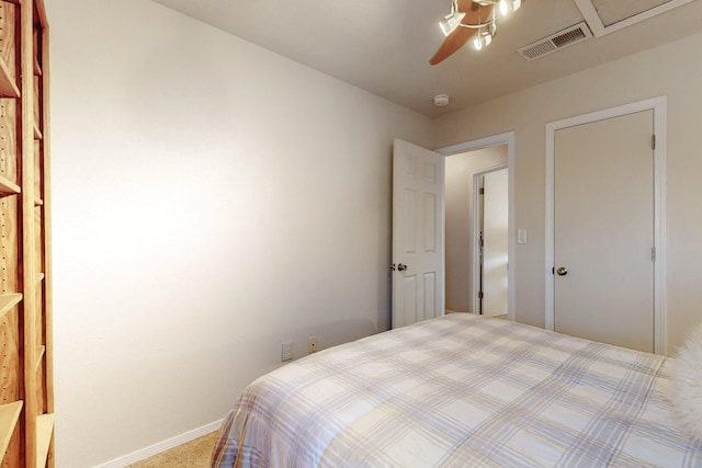 carpeted bedroom with ceiling fan, visible vents, and baseboards