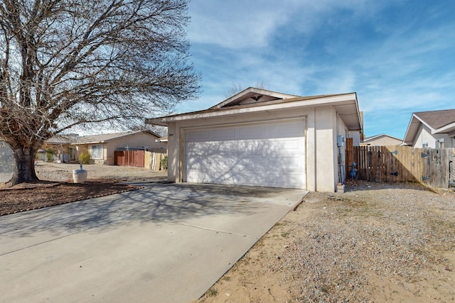 exterior space featuring fence and stucco siding