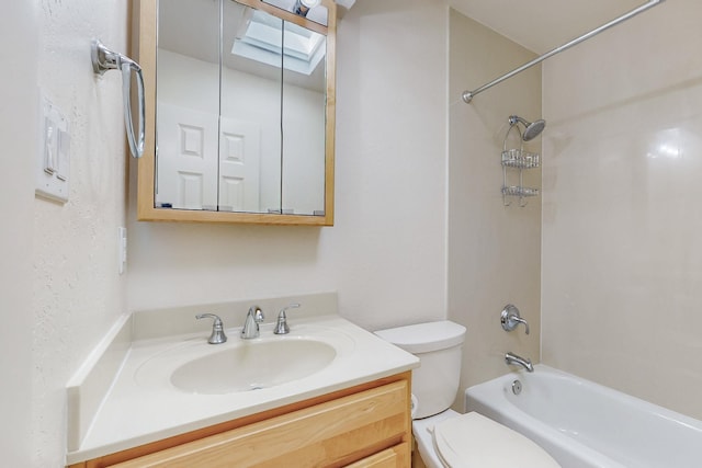 bathroom featuring a skylight, shower / bath combination, vanity, and toilet