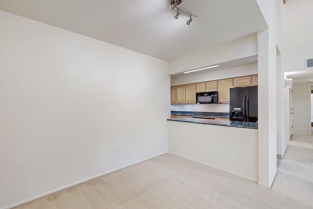 kitchen with light brown cabinets, light carpet, visible vents, black appliances, and dark countertops