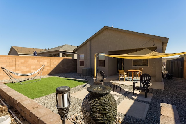 exterior space with a fire pit and fence