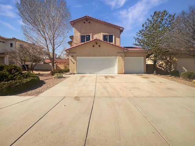 mediterranean / spanish-style home with a garage, a tile roof, driveway, and stucco siding