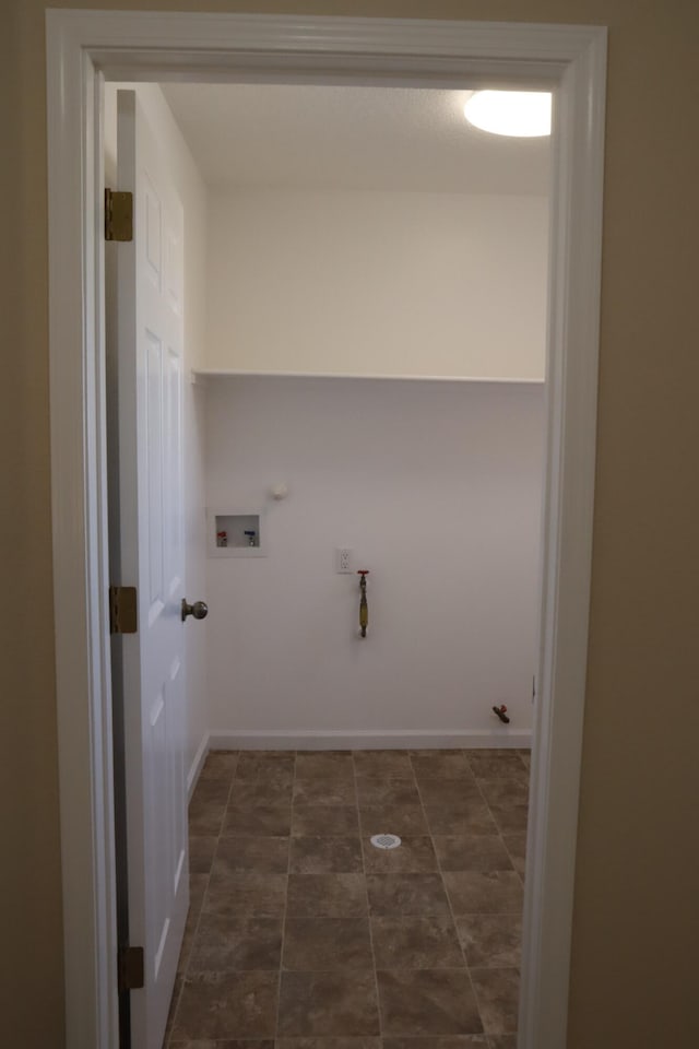 laundry room featuring baseboards, laundry area, hookup for a washing machine, and hookup for a gas dryer