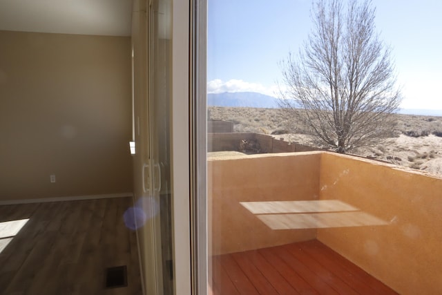 balcony featuring a mountain view