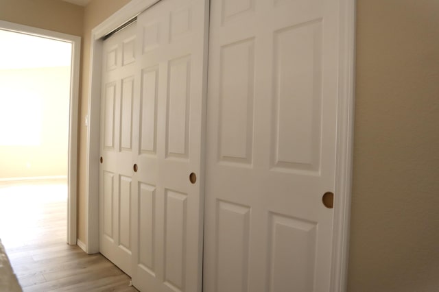 hall with light wood-style flooring