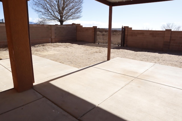 view of patio with a fenced backyard and a gate