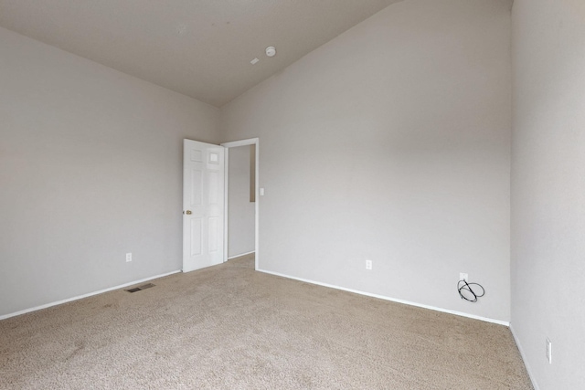 9801 Basha St NW, Albuquerque, NM 87114 - carpeted empty room with vaulted ceiling and baseboards