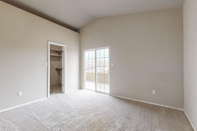 9801 Basha St NW, Albuquerque, NM 87114 - unfurnished bedroom with carpet flooring, a walk in closet, and high vaulted ceiling