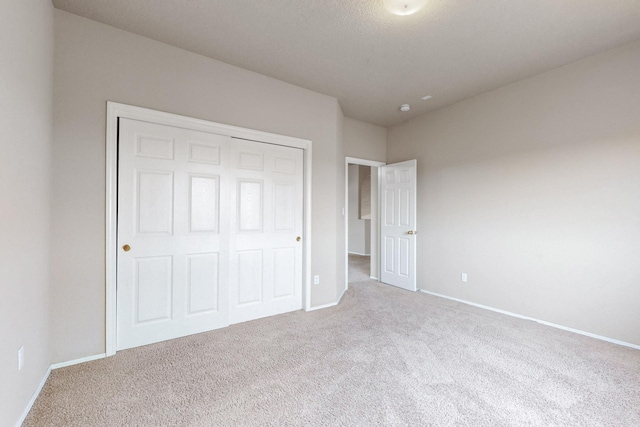 9801 Basha St NW, Albuquerque, NM 87114 - unfurnished bedroom with carpet floors and a closet