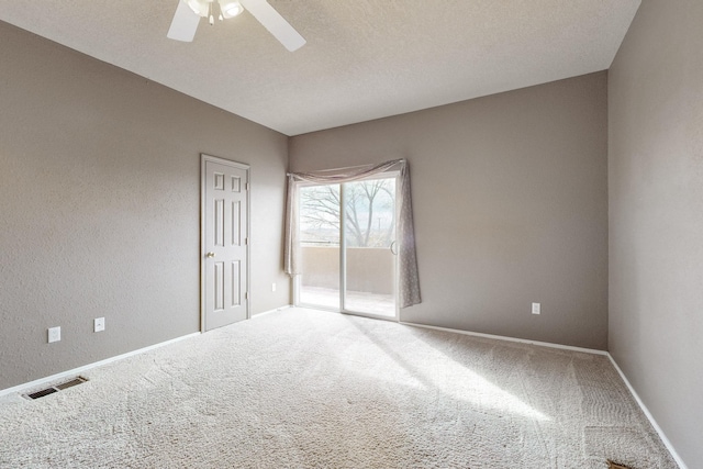 9801 Basha St NW, Albuquerque, NM 87114 - spare room with carpet, a ceiling fan, a textured wall, and a textured ceiling