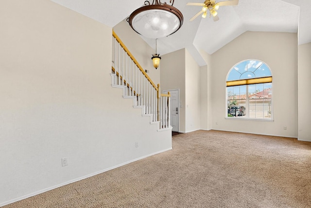 9801 Basha St NW, Albuquerque, NM 87114 - unfurnished living room featuring high vaulted ceiling, carpet floors, stairway, and ceiling fan
