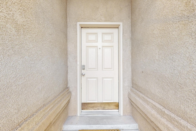9801 Basha St NW, Albuquerque, NM 87114 - doorway to property featuring stucco siding