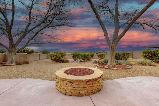 9801 Basha St NW, Albuquerque, NM 87114 - patio terrace at dusk featuring a patio and a fenced backyard