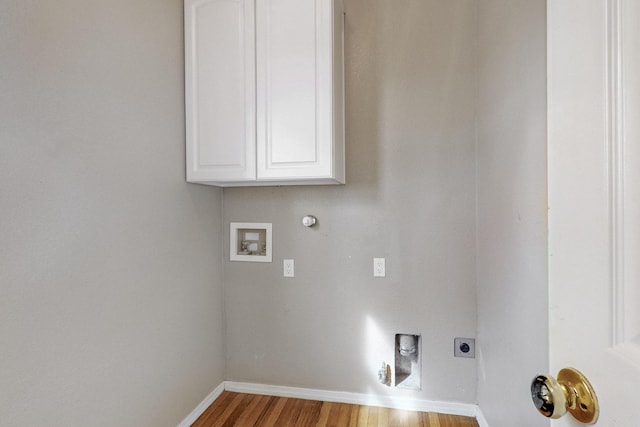 9801 Basha St NW, Albuquerque, NM 87114 - washroom with hookup for a gas dryer, wood finished floors, washer hookup, cabinet space, and hookup for an electric dryer