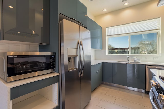 kitchen with a sink, stainless steel fridge with ice dispenser, light countertops, range, and range hood