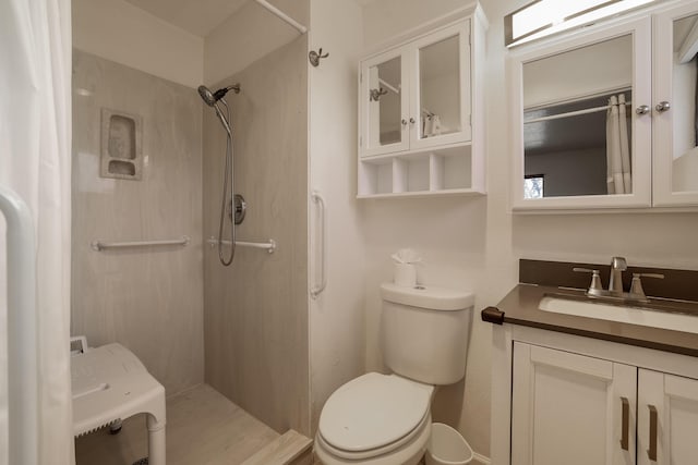 full bath with a shower, vanity, and toilet