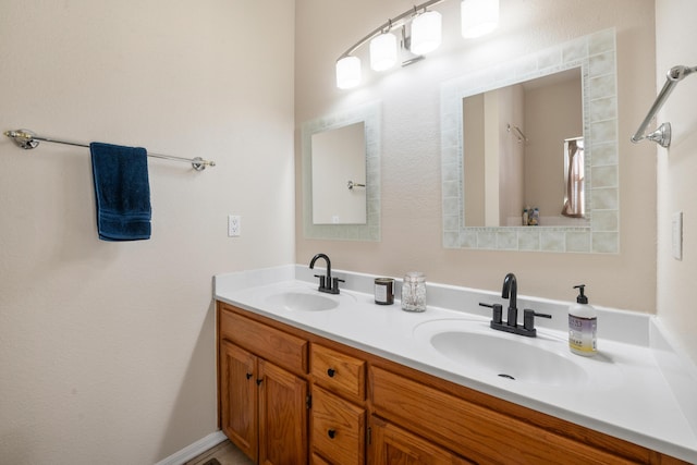 bathroom with a sink and double vanity