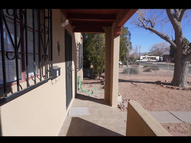 view of patio / terrace featuring fence