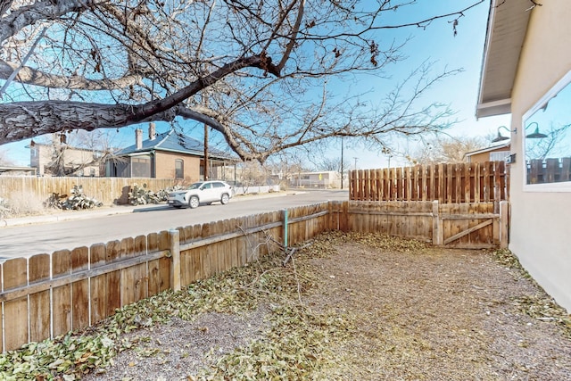 view of yard with fence and a residential view