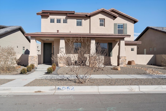 view of front of house featuring stucco siding