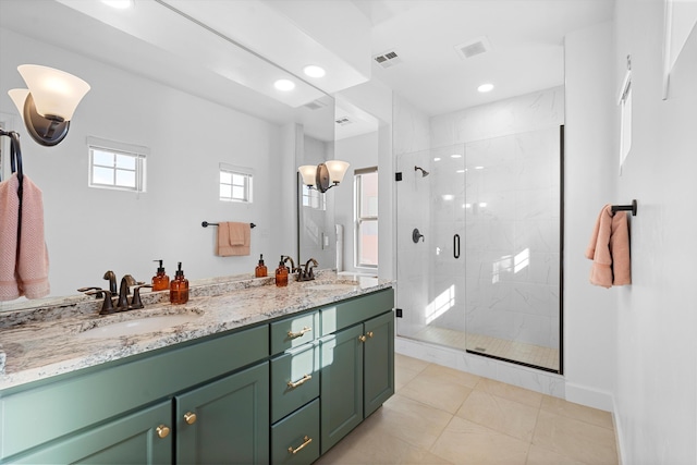 6052 Nauman Dr SE, Albuquerque, NM 87106 - bathroom featuring double vanity, a sink, visible vents, and a shower stall