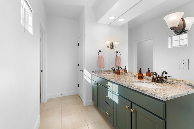 6052 Nauman Dr SE, Albuquerque, NM 87106 - bathroom featuring double vanity, baseboards, a sink, and tile patterned floors