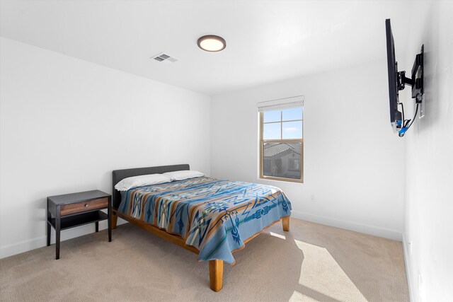 6052 Nauman Dr SE, Albuquerque, NM 87106 - bedroom with visible vents, light carpet, and baseboards