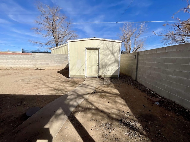 view of shed featuring a fenced backyard