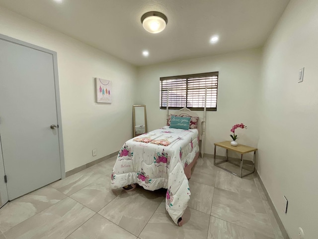 bedroom with recessed lighting and baseboards