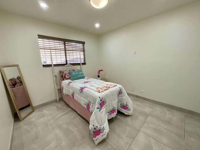 bedroom featuring recessed lighting and baseboards