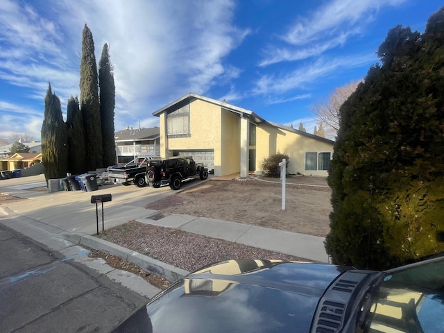 view of side of home featuring stucco siding