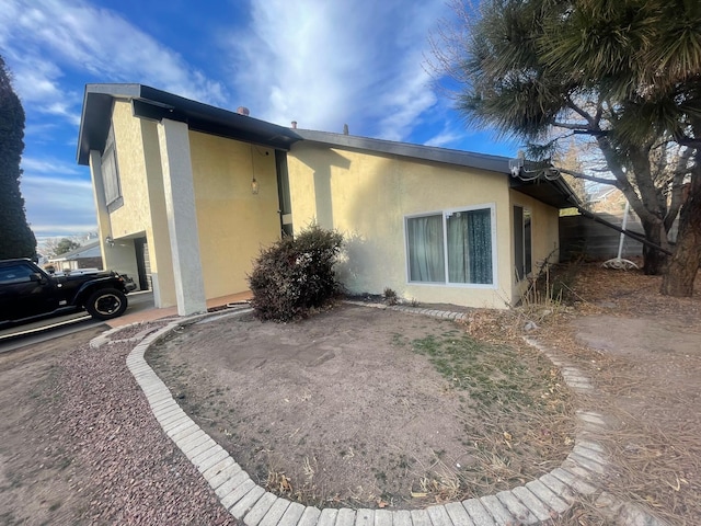 exterior space with stucco siding