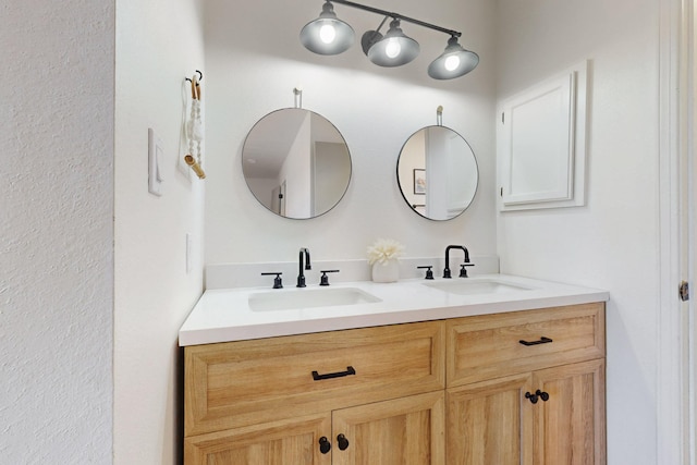 bathroom featuring double vanity and a sink