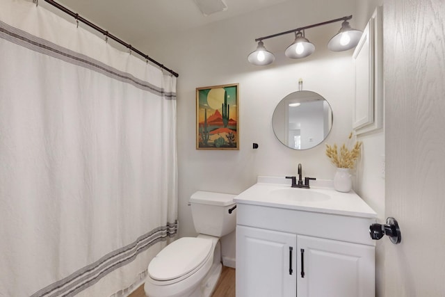 full bathroom featuring curtained shower, vanity, and toilet