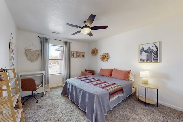 bedroom featuring carpet floors, visible vents, baseboards, and a ceiling fan