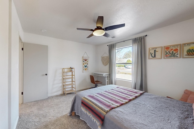 carpeted bedroom with ceiling fan, visible vents, and baseboards