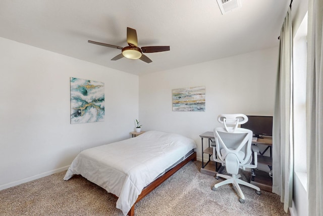 bedroom featuring carpet floors, baseboards, visible vents, and a ceiling fan