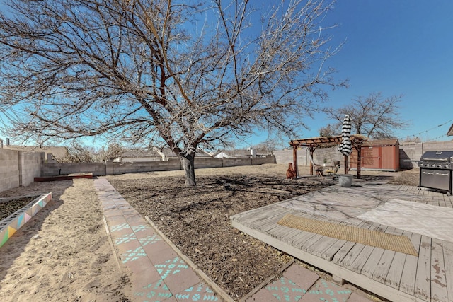 view of yard featuring a fenced backyard, a patio, and a pergola